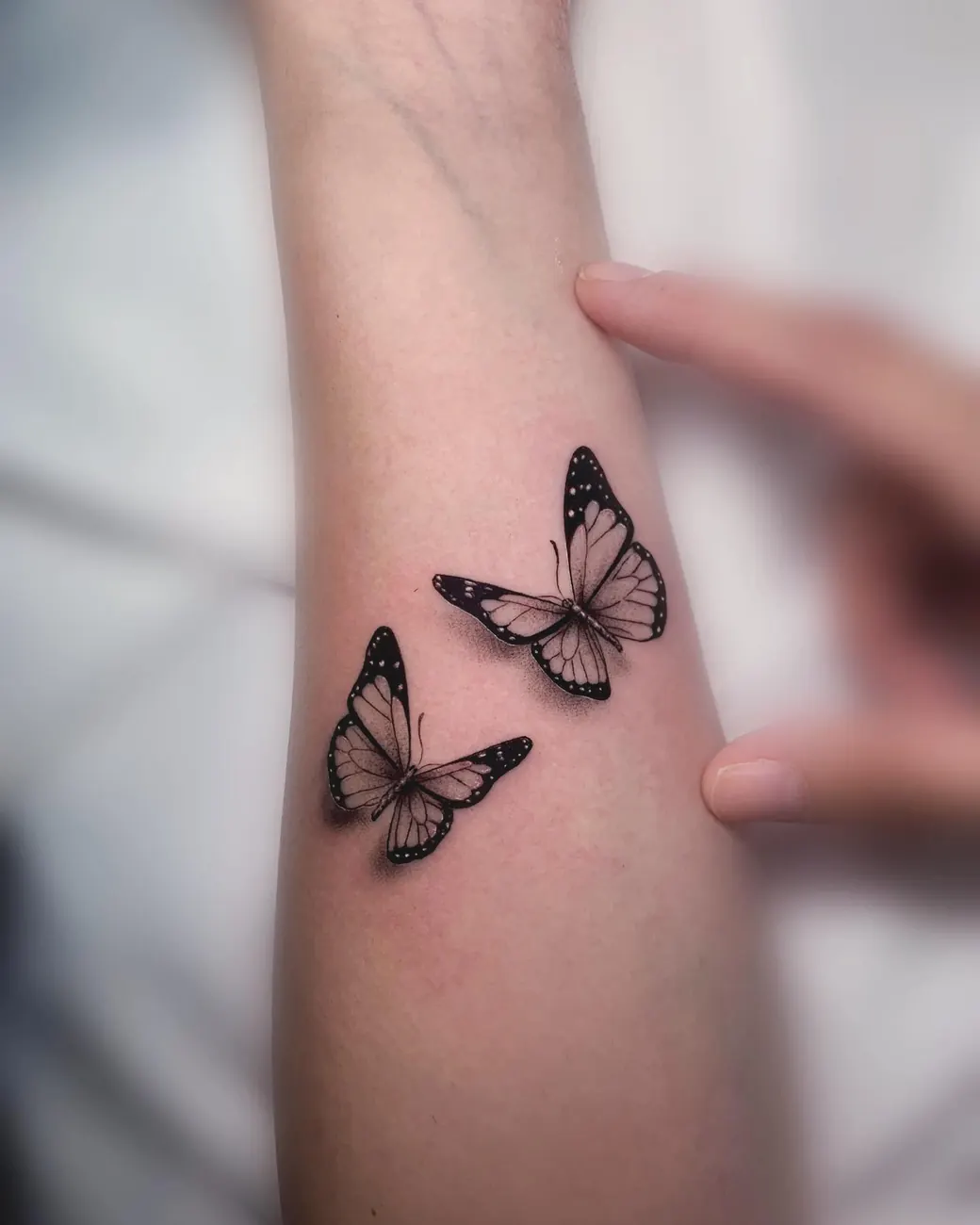 Tattoo: Shaded butterflies, forearm