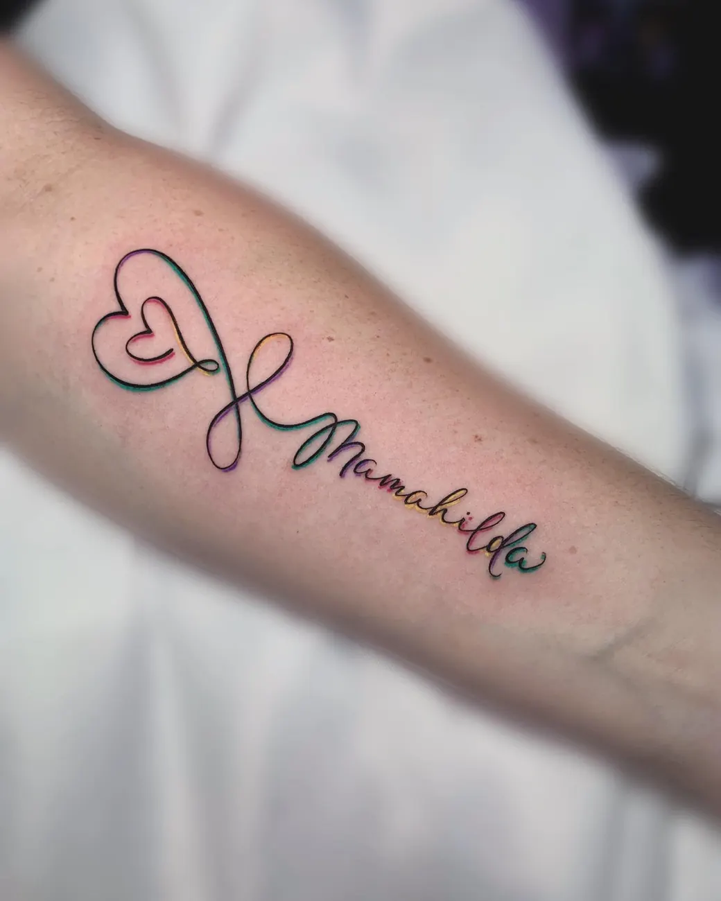 Tattoo: Name with heart, forearm