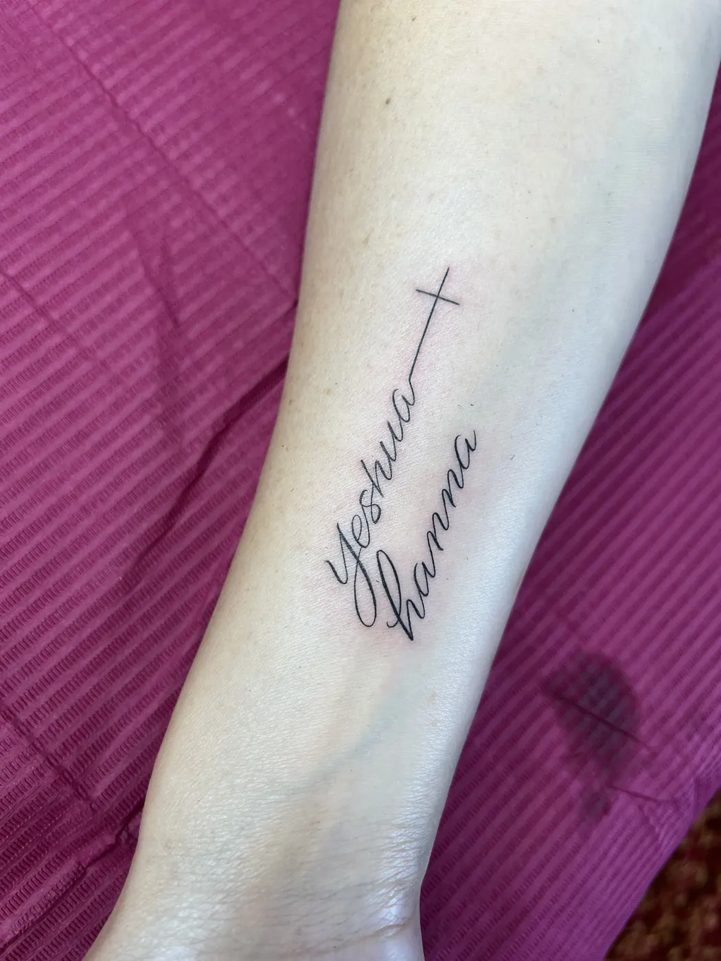 Tattoo: Names with cross, forearm